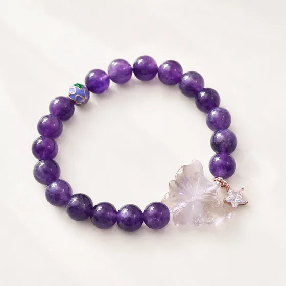 Amethyst, with a carved amethyst butterfly, a zircon star and one cloisonné bead.