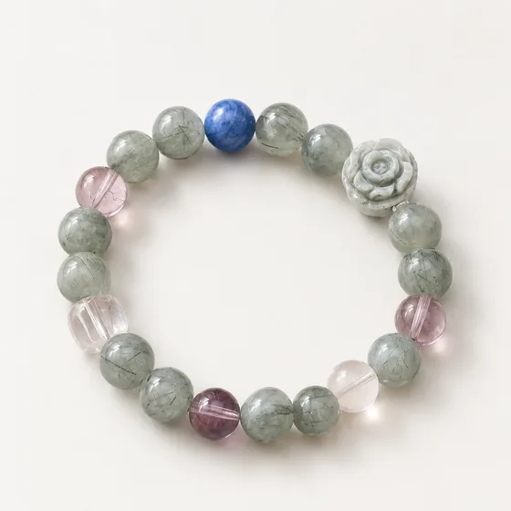 Green rutilated quartz with amethyst, rose quartz and lapis lazuli, and a carved Alxa agate rose.
