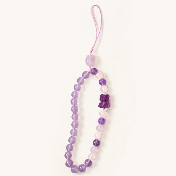 Amethyst and rose quartz, with a small bear carved from purple fluorite.