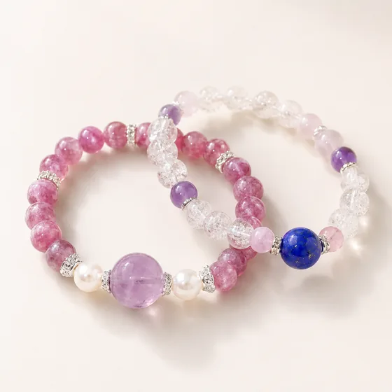 Two strands: one with rose quartz and shell pearl, one with rose quartz, amethyst and a single lapis lazuli bead.